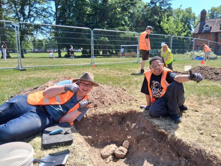 People excavating at a community archaeology project at Ashburton Park in May 2026