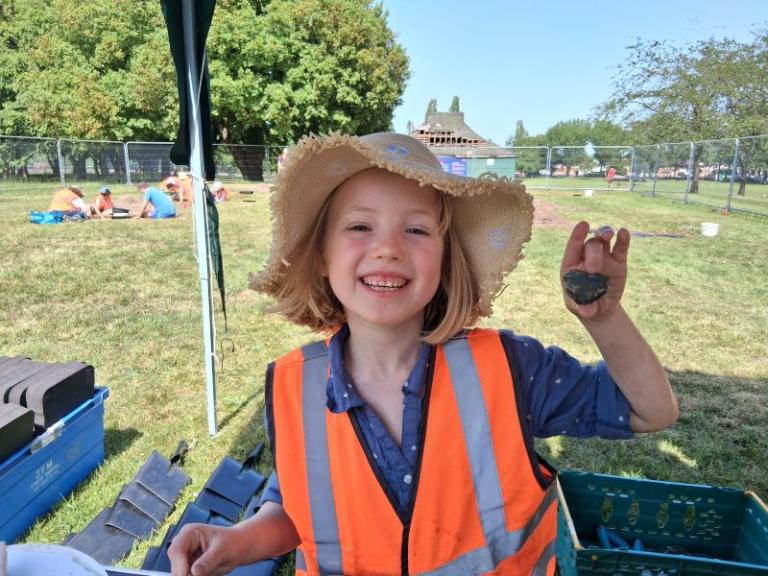 A girl at a community archaeology project at Ashburton Park in May 2026