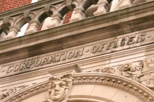 Photo of an archway above an entrance to the town hall, featuring the words "Corporation offices"