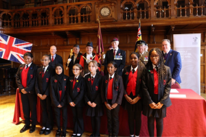Civic and Executive Mayors with military personnel and school children at the signing of the Armed Forces Covenant