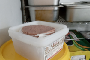 Food incorrectly stored in a chicken shop kitchen