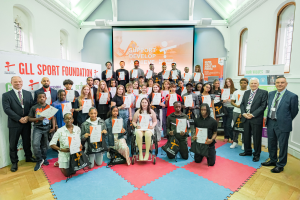 A group of around 50 young people with their certificates at the GLL Sports Awards