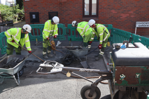 Highways contractors repairing a pothole