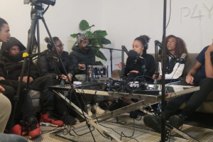 A group of young people recording a podcast