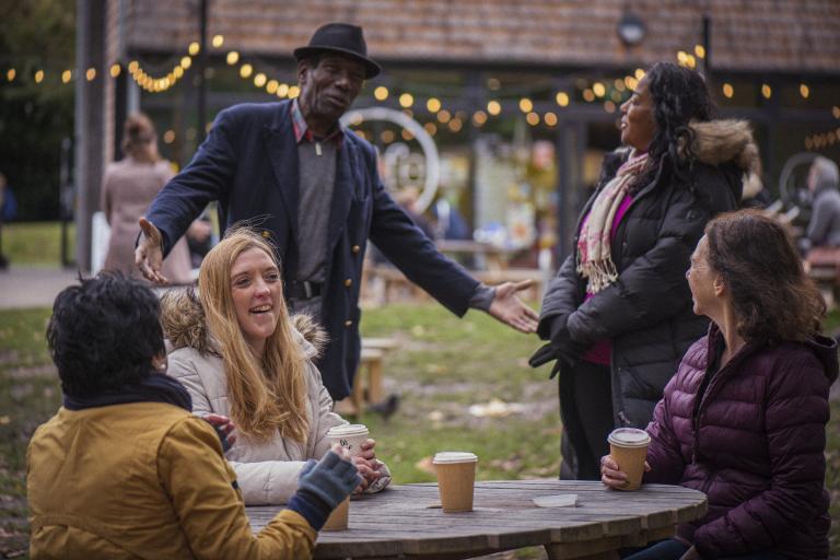 Group of people drinking coffee outside