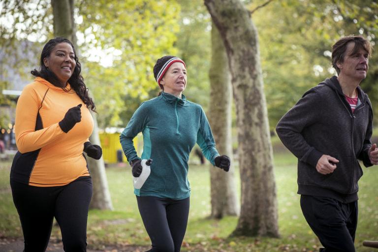 Three people jogging in the park