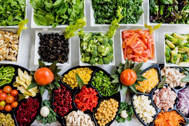 A selection of fresh vegetable on serving platters.