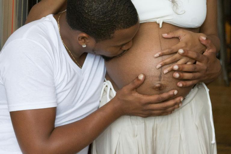 A pregnant couple with a baby on the way