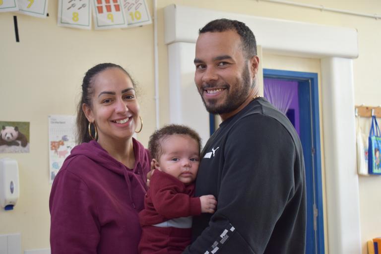 Parents holding their baby